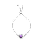 Silver bracelet with a purple gemstone on a white background