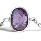 Silver bracelet with a purple gemstone on a white background
