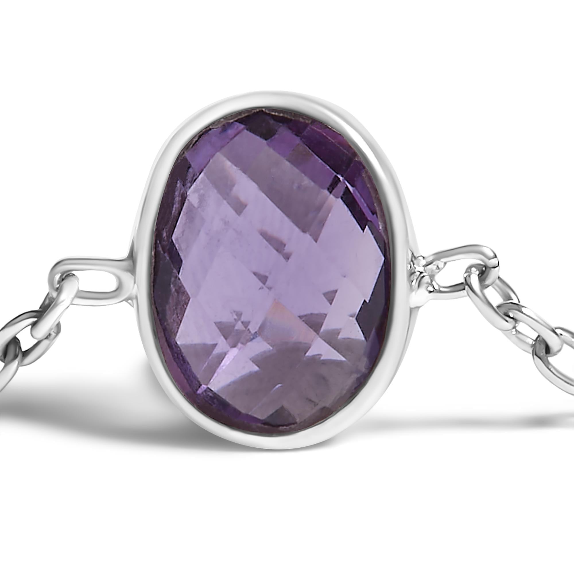 Silver bracelet with a purple gemstone on a white background
