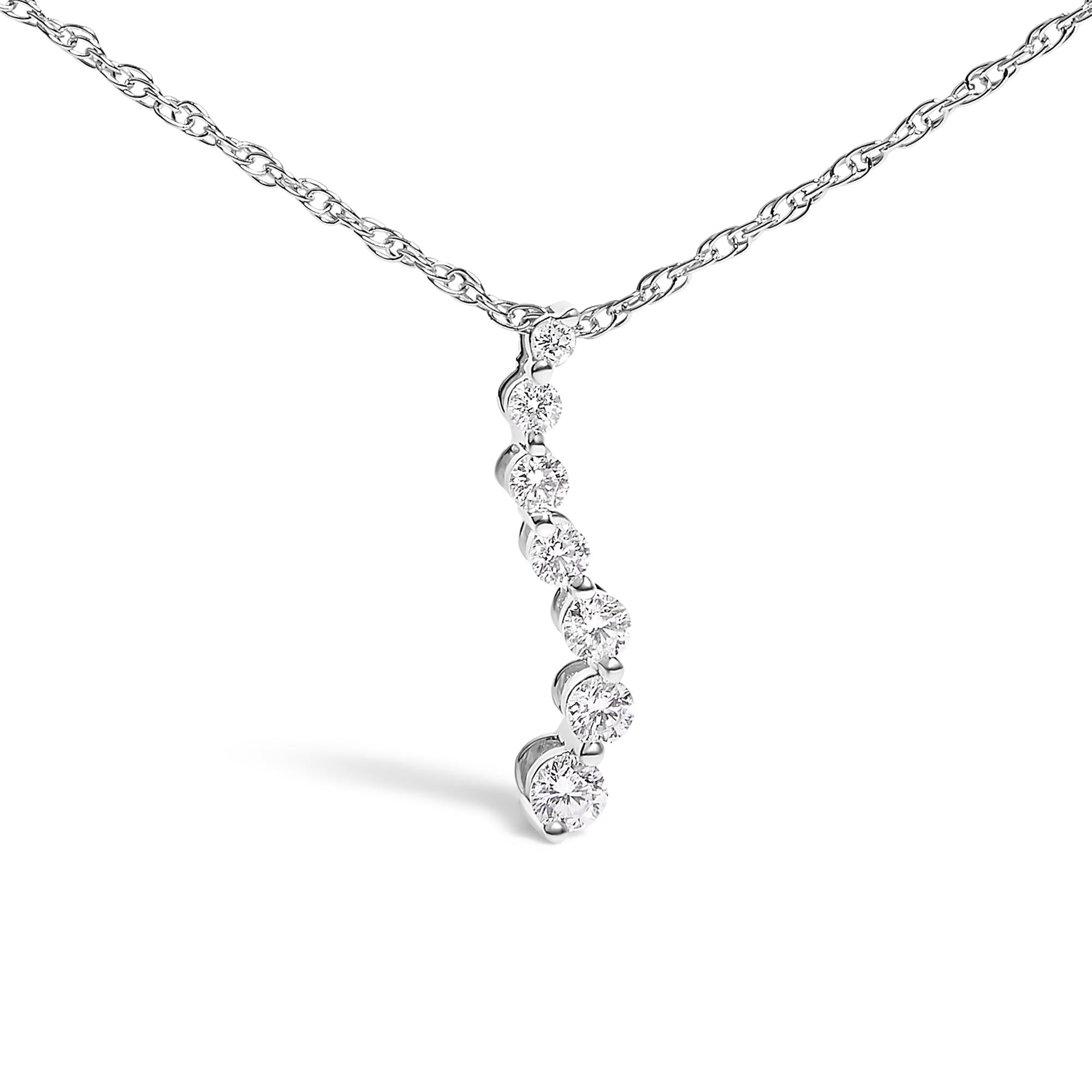Silver necklace with a diamond pendant on a white background