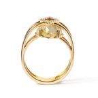 Gold ring with a yellow gemstone on a white background