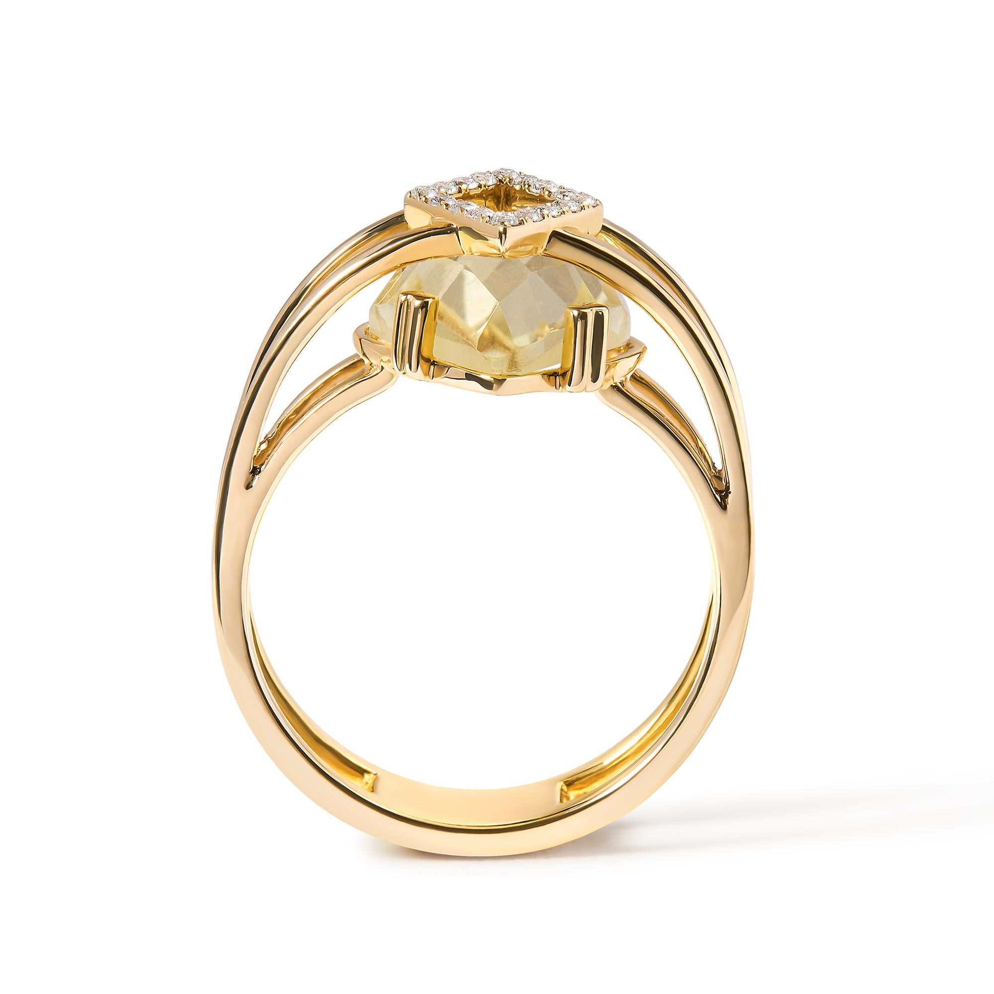 Gold ring with a yellow gemstone on a white background