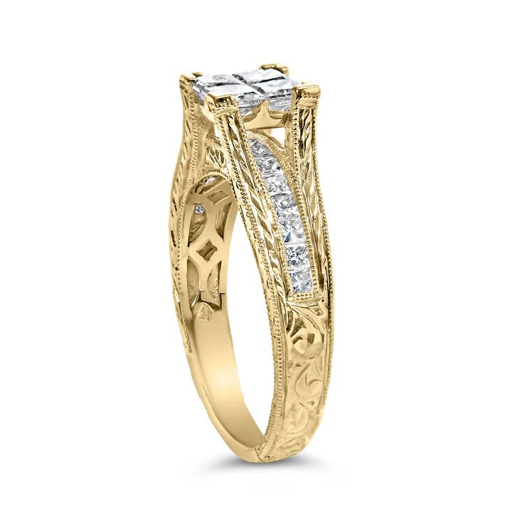 Gold ring with diamond accents on a white background