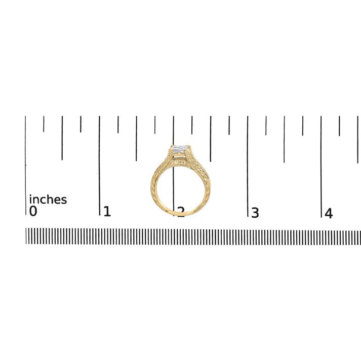 Gold ring with diamond on a white background with a ruler for scale.