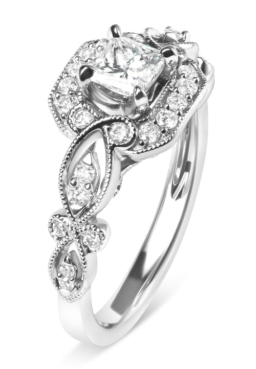 Silver ring with a central diamond and smaller stones on a white background