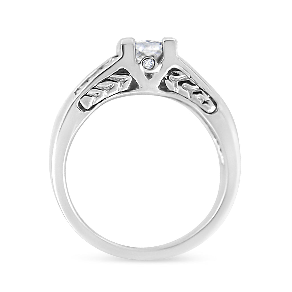 Silver ring with a diamond on a white background