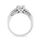Silver ring with a diamond on a white background