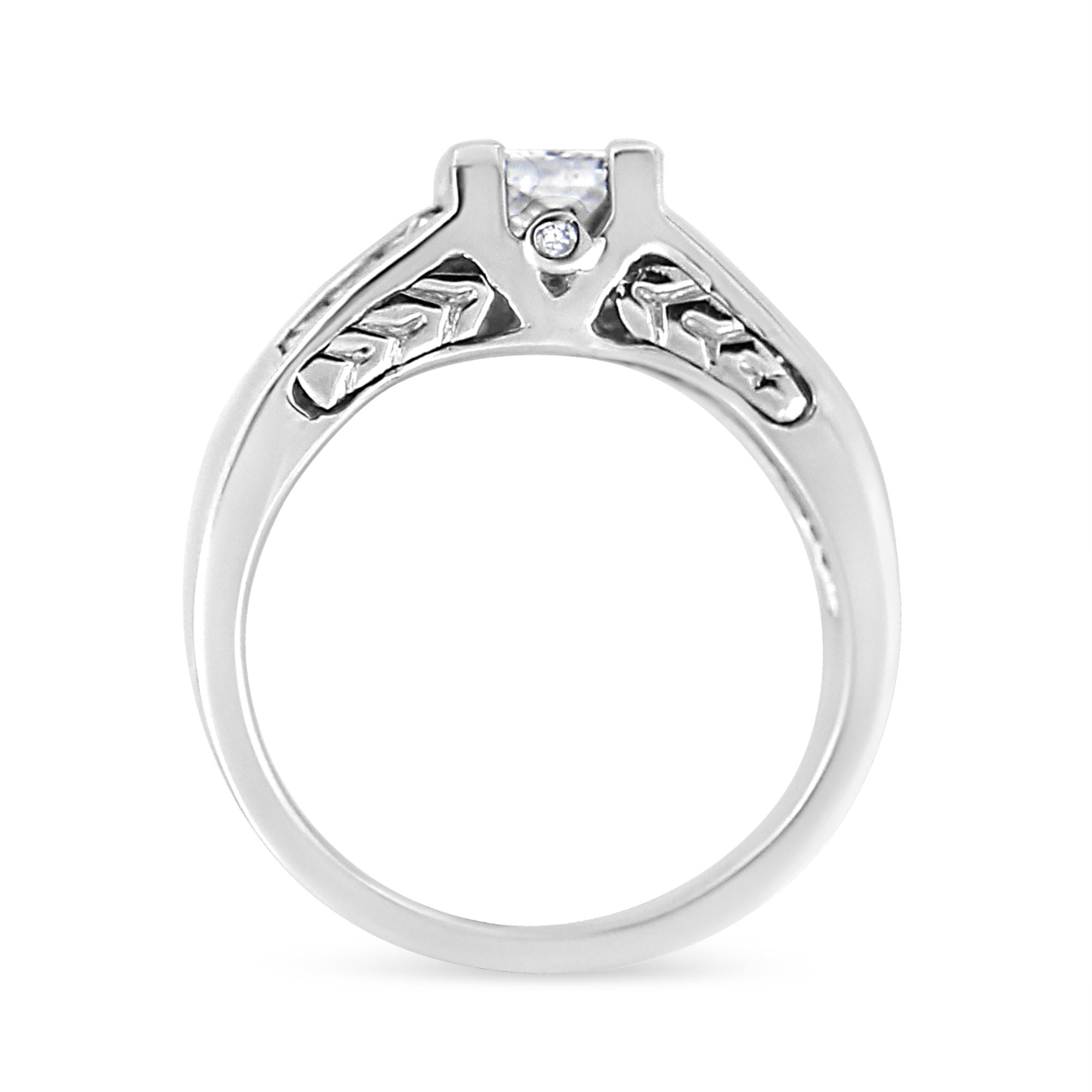Silver ring with a diamond on a white background