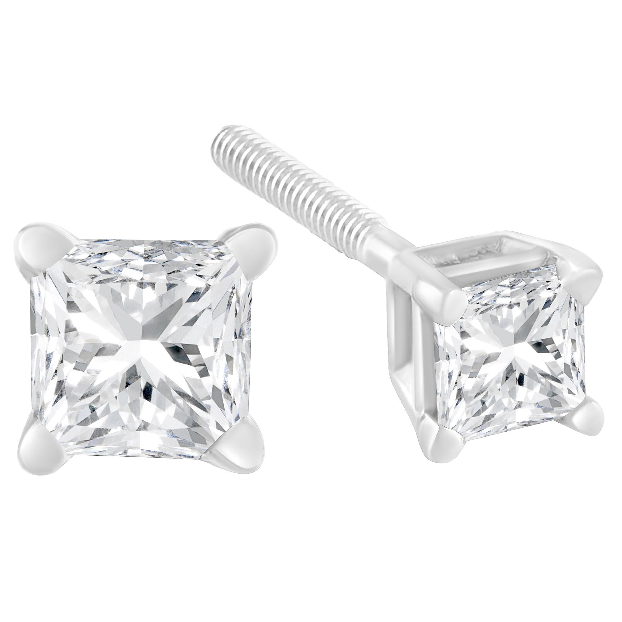 Pair of diamond stud earrings on a white background