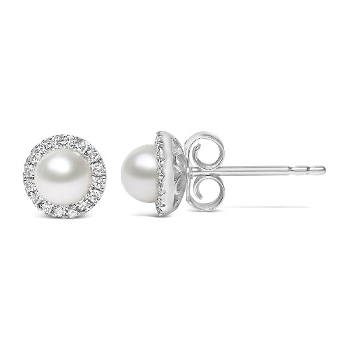 Pearl stud earrings with diamond accents on a white background