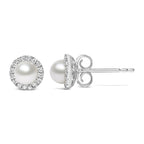 Pearl stud earrings with diamond accents on a white background