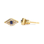 Gold earrings with blue gemstones and clear stones on a white background