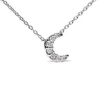 Silver necklace with a crescent moon pendant on a white background