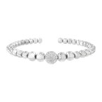 Silver beaded bracelet with a decorative ball on a white background