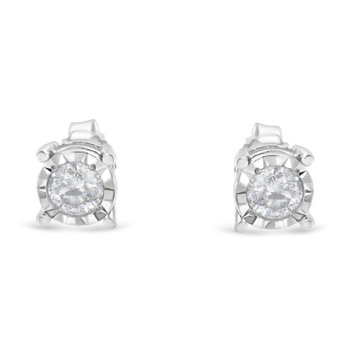 Pair of silver stud earrings with clear gemstones on a white background