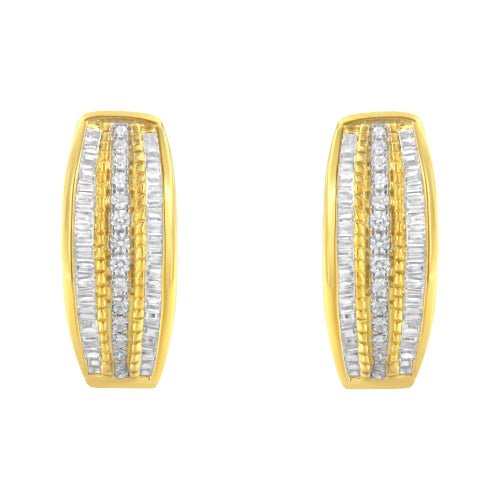 Gold and silver earrings on a white background