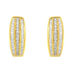 Gold and silver earrings on a white background