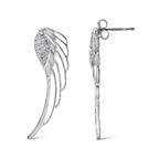 Silver wing-shaped earrings on a white background