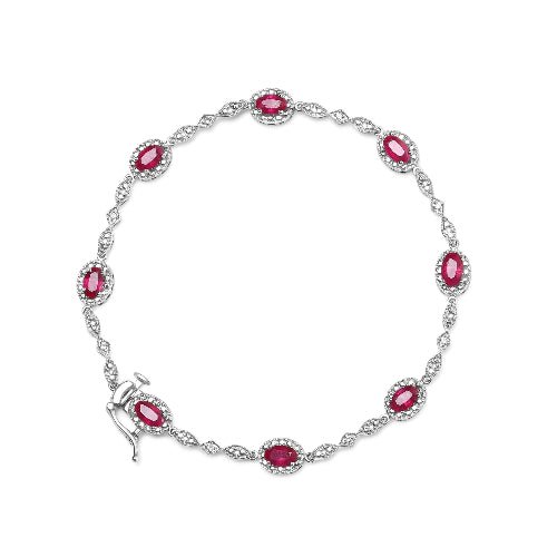 Silver bracelet with red gemstones on a white background