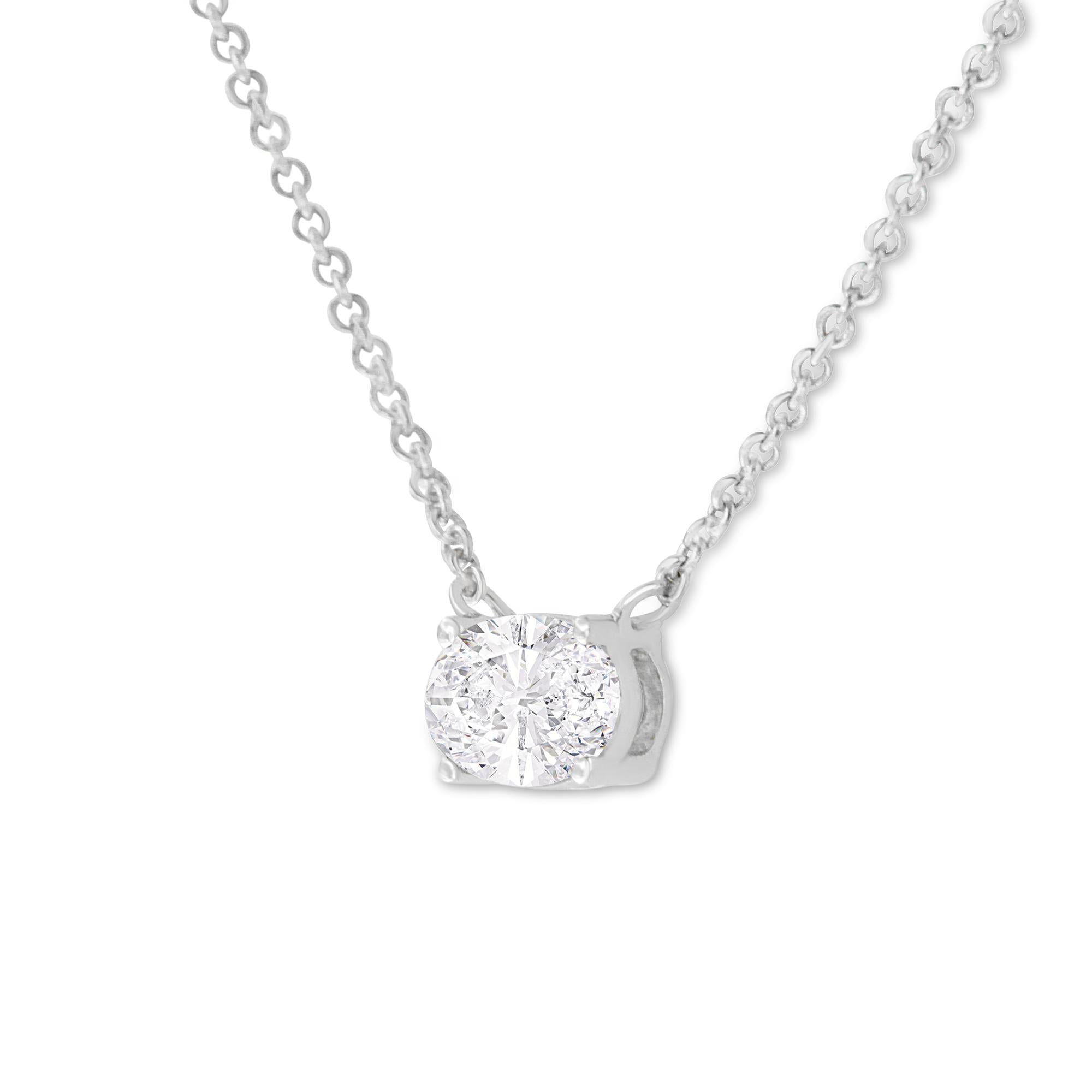 Silver necklace with a IGI certified diamond pendant on a white background