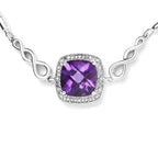 Silver necklace with a purple gemstone on a white background