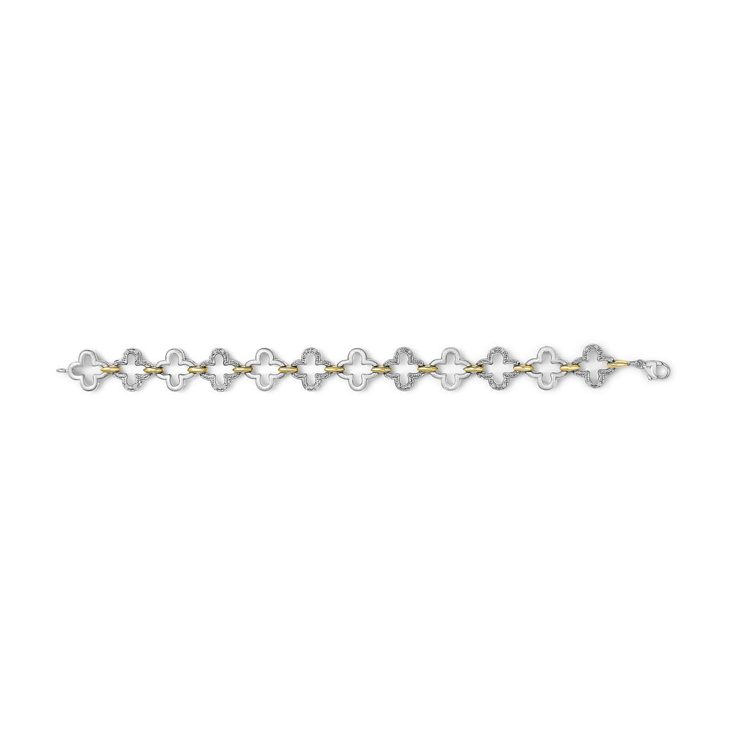 Bracelet with alternating gold and silver links on a white background