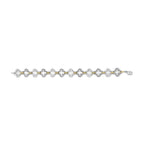 Bracelet with alternating gold and silver links on a white background