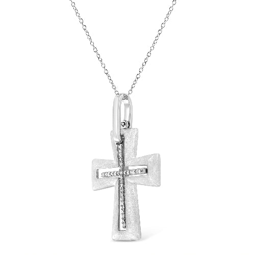 Silver cross pendant on a chain against a white background