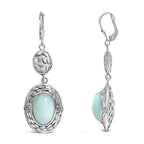 Silver earrings with light blue gemstones on a white background