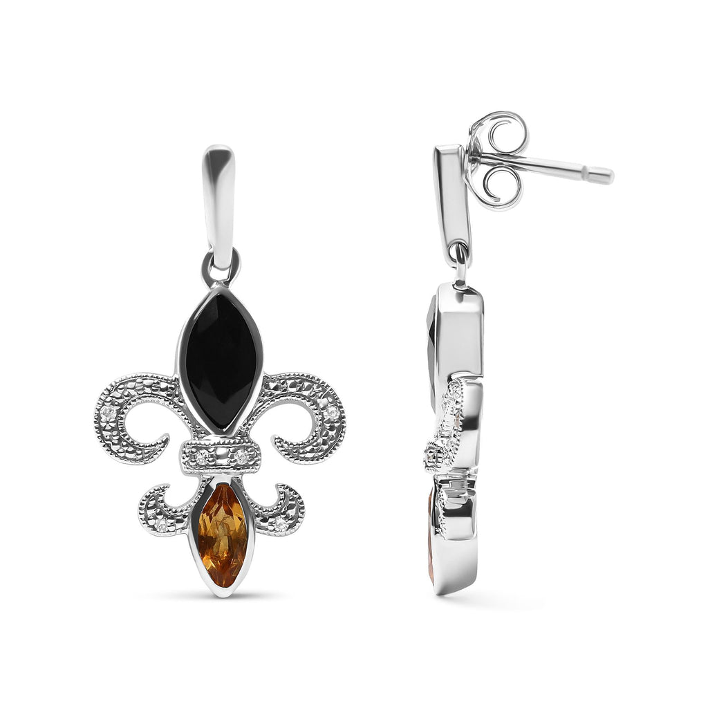 Silver earrings with black and amber gemstones on a white background