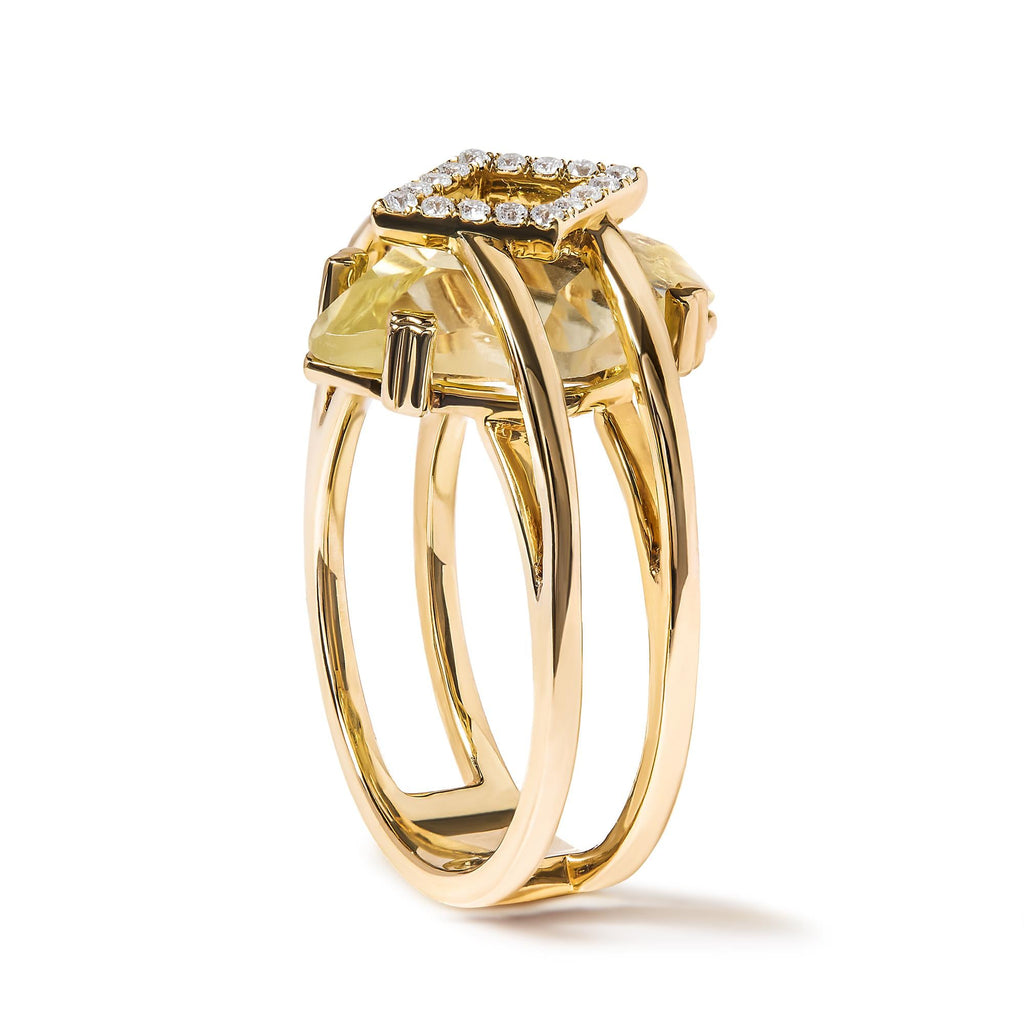 Gold ring with a large yellow gemstone and smaller diamonds on a white background