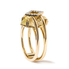 Gold ring with a large yellow gemstone and smaller diamonds on a white background