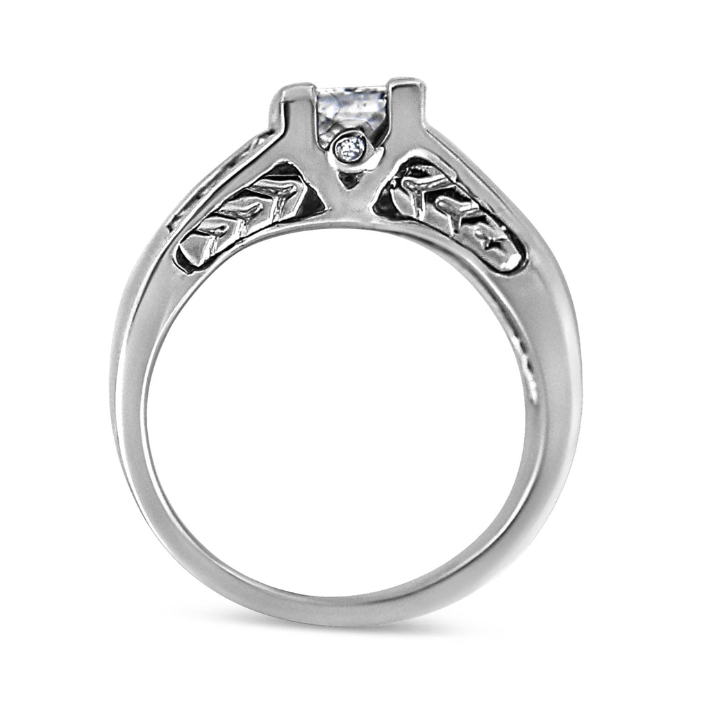 Silver ring with a diamond on a white background