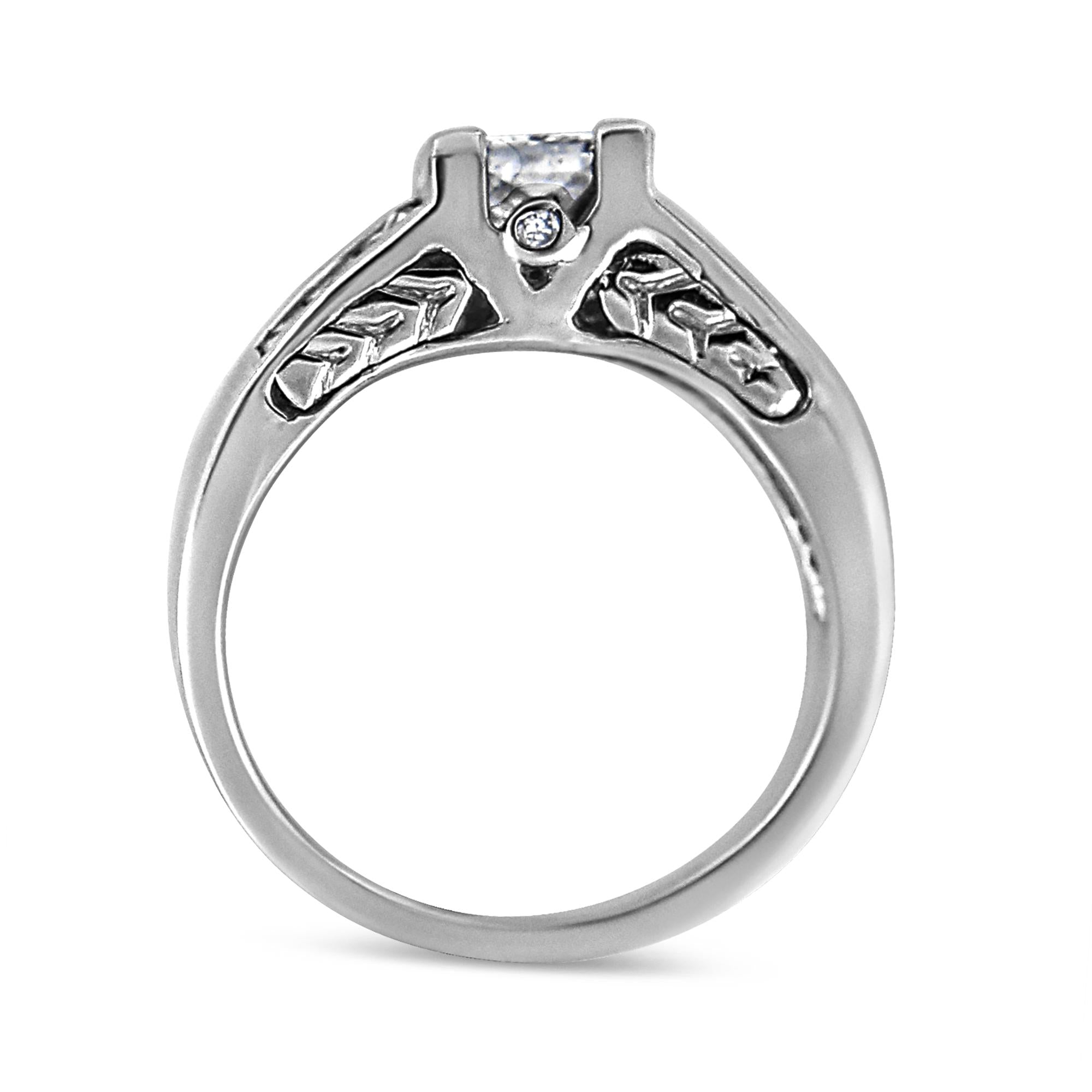 Silver ring with a diamond on a white background