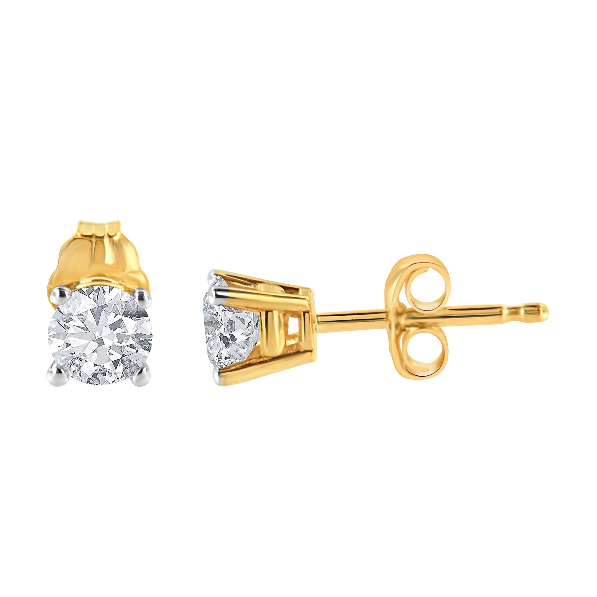 Gold diamond stud earrings on a white background