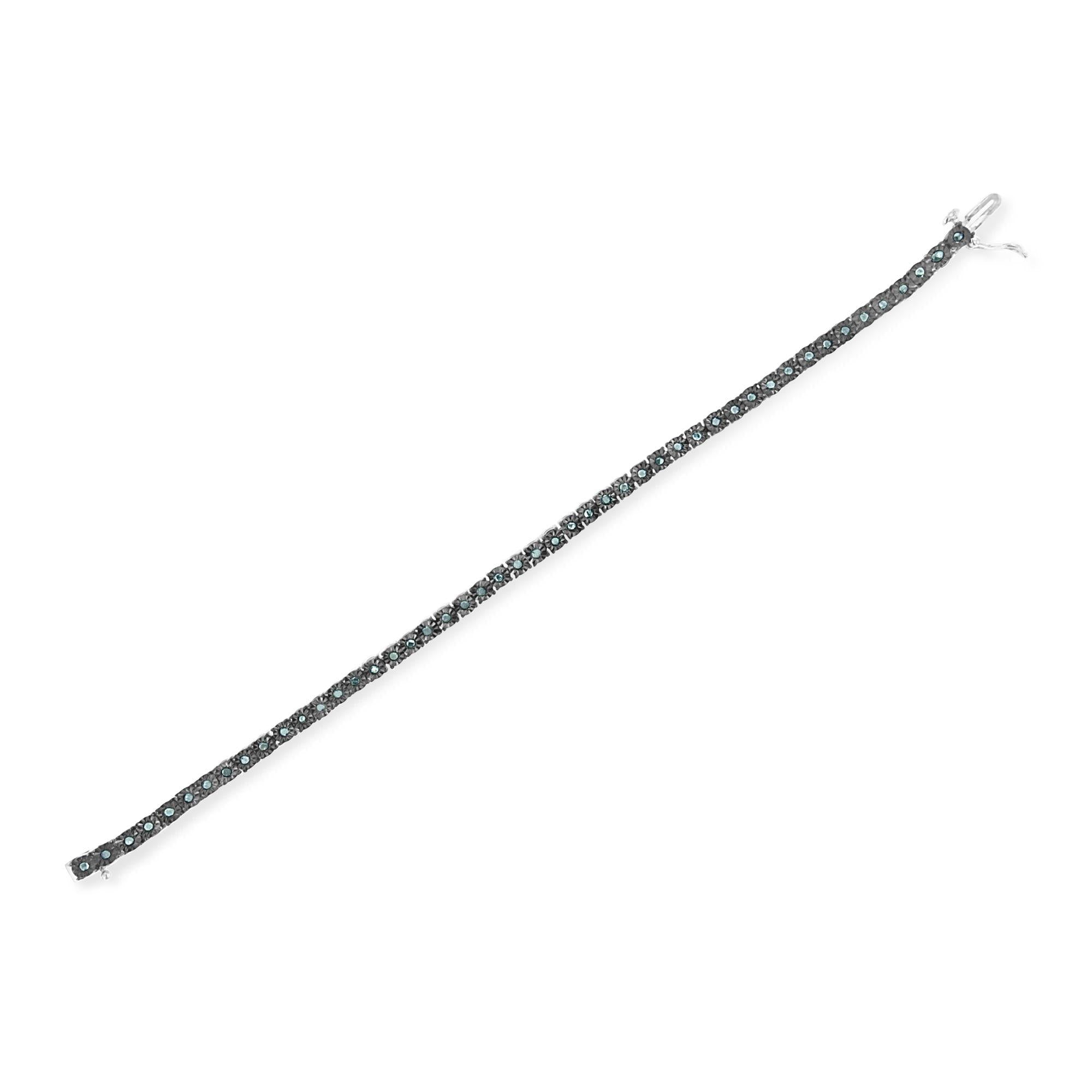 Silver bracelet with black stones on a white background