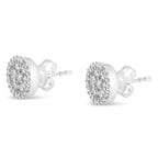 Pair of silver stud earrings with clear gemstones on a white background