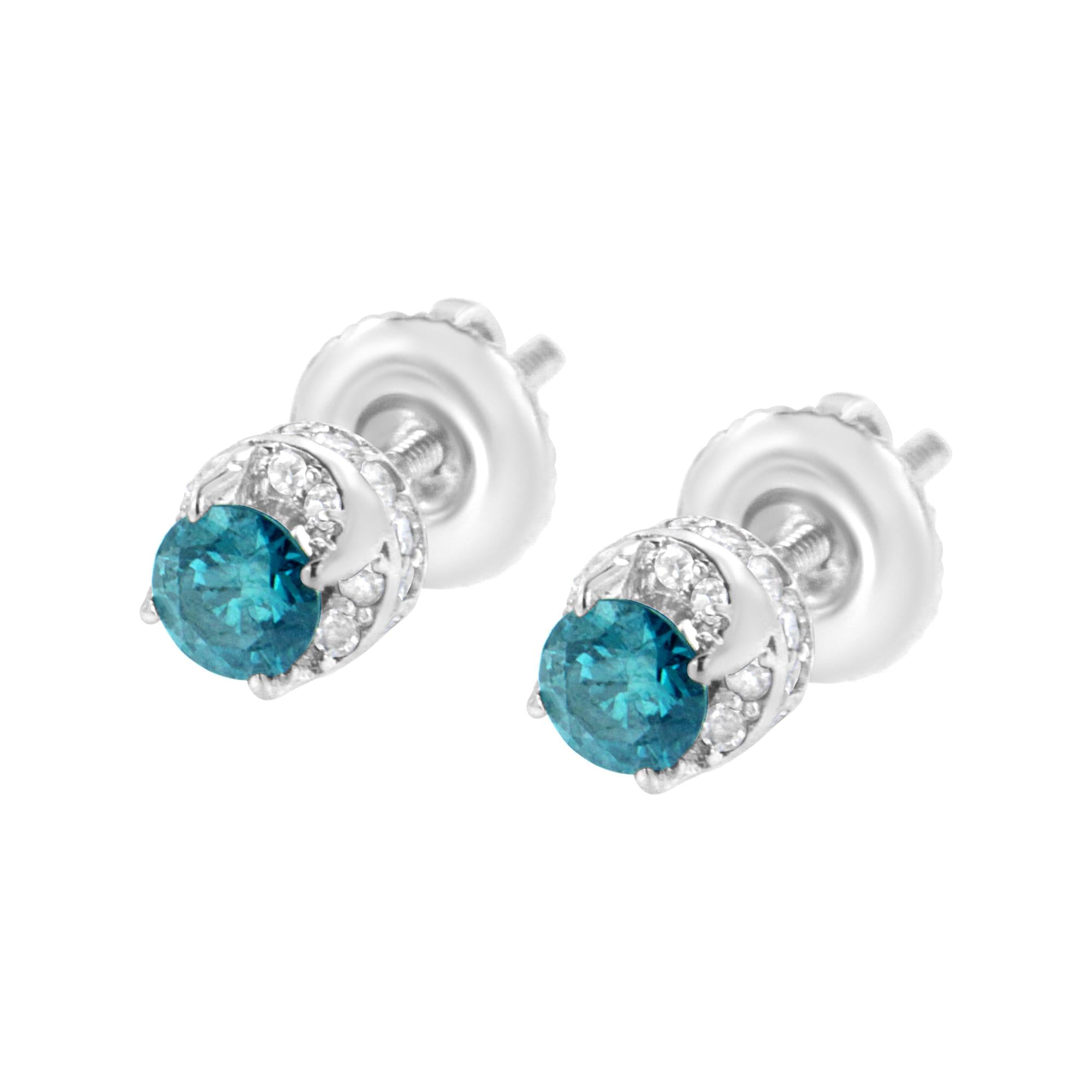 Pair of silver earrings with blue gemstones on a white background