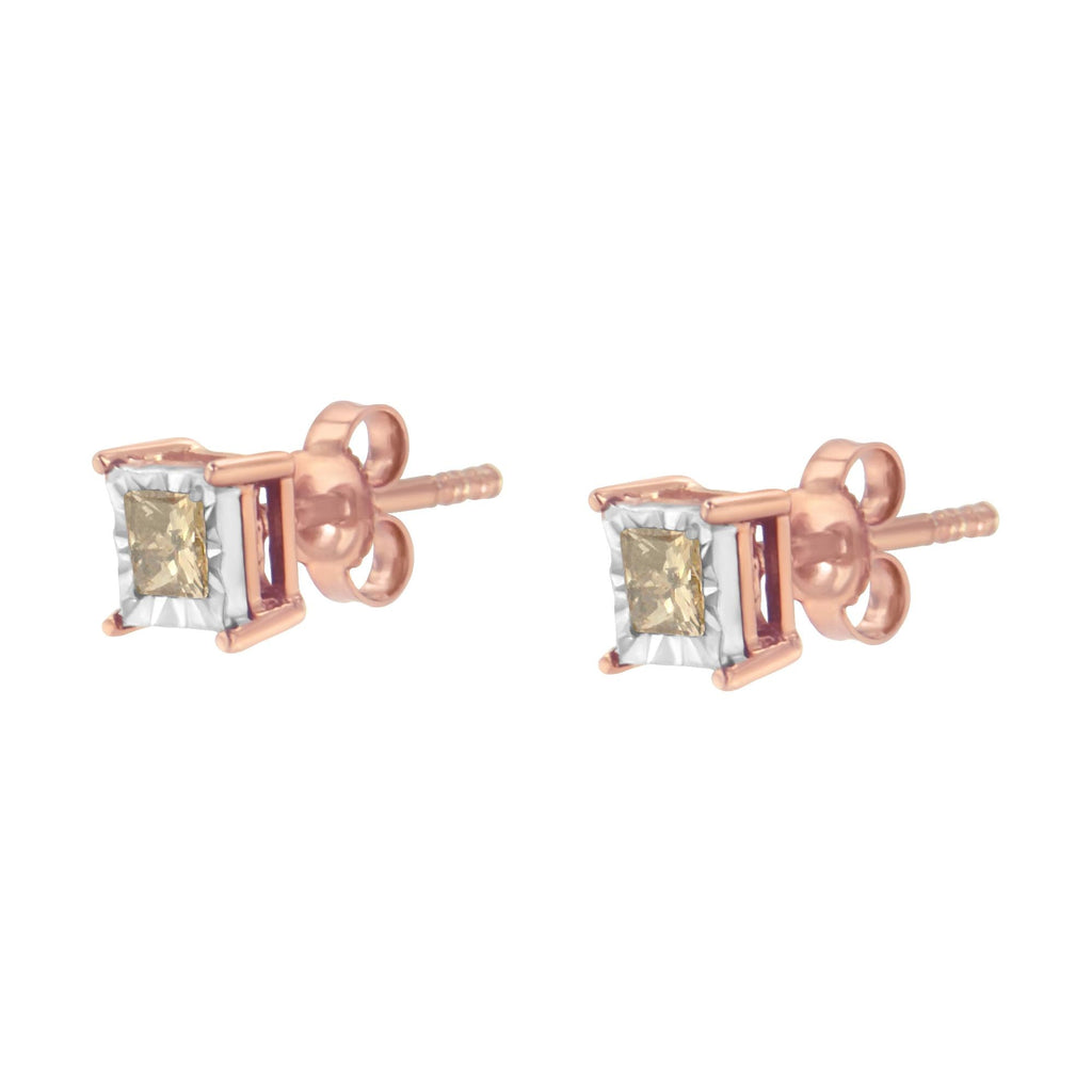 Rose gold earrings with square-cut gemstones on a white background