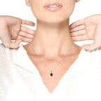 Necklace with a pendant being worn on a mannequin neck