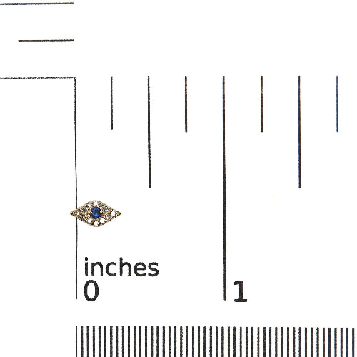 Jewelry with a blue gemstone on a measurement scale from 0 to 1 inch.