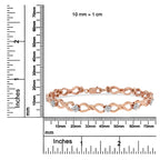 Rose gold bracelet with diamonds on a white background with measurement scale