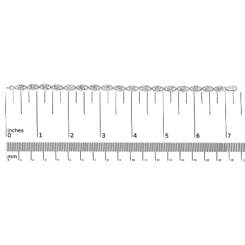 Silver bracelet with a ruler for size reference on a white background