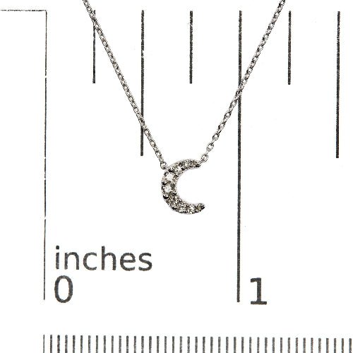 Silver crescent moon necklace on a white background with measurement scale
