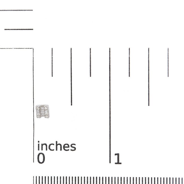 Silver square-shaped earring on a ruler for scale