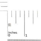 Silver square-shaped earring on a ruler for scale