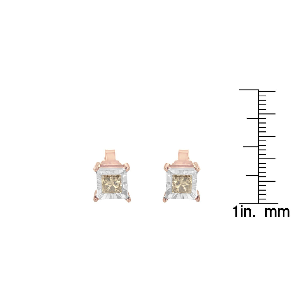 Rose gold square-cut gemstone earrings with a measurement scale on a white background