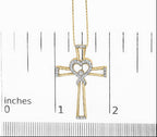 Gold cross necklace with heart detail on a measurement scale