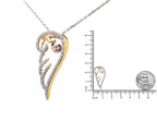 Gold and silver pendant with chain, shown with a ruler for scale on a white background