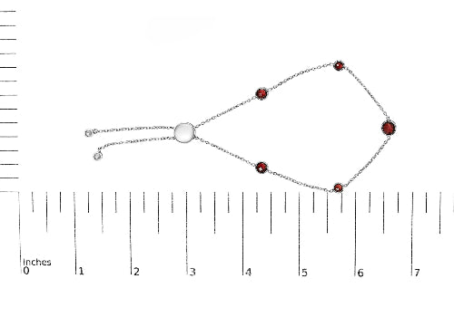 Bracelet with red beads on a white background with a ruler for scale.